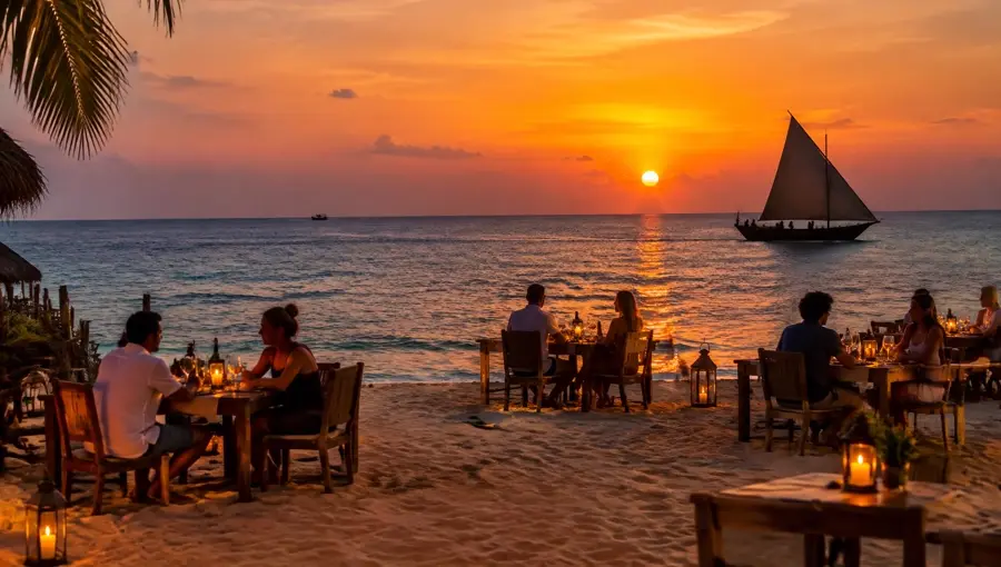 Guests dining on Nungwi beach at sunset